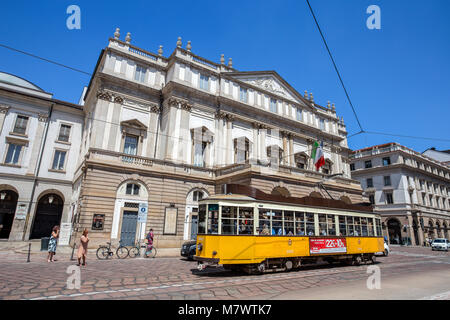 MILAN, ITALY, JUNE, 7, 2017 - Teatro alla Scala (Theatre La Scala) with a typical Milan old tram. Is the main opera house in Milan. Considered one of  Stock Photo