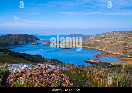 A view over a tidal inlet to Eddrachillis Bay and the open sea beyond, seen from the A894 near Scourie, Sutherland, North Coast 500 route, Scotland UK Stock Photo