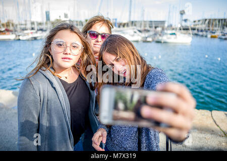 Three young women taking a selfie in Barcelona Stock Photo