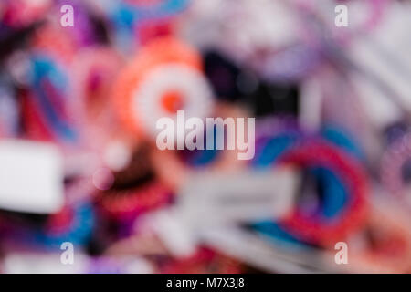 blurred background bright multi-colored elastic hair bands. Stock Photo