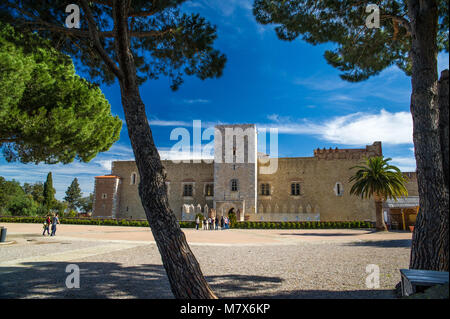 Perpignan (southern France). Group of tourists at the entrance to the Palace of the Kings of Majorca (Palau dels Reis de Mallorca in Catalan) situated Stock Photo