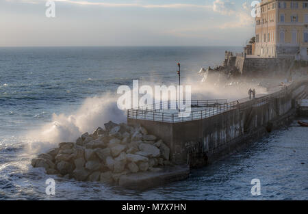 Big stormy waves crashing over the coast - Genoa Nervi pier, Italy Stock Photo