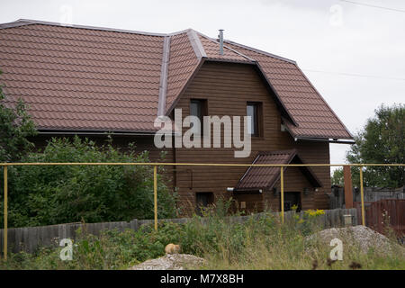 the house is sheathed in brown wood Stock Photo