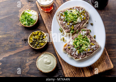Raw meat sandwiches. CRUDO VALDIVIANO. tipical chilean food from region Valdivia. Chilean food, aleman food. Tartar sandwiches Stock Photo