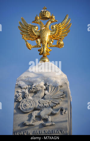 Shining Romanov’s Two-Headed Eagle and Griffin in Winter Sunset Stock Photo