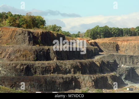 A Rock Quarry dug out mountain side Stock Photo