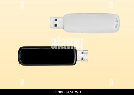 Two USB flash drives on yellow background Stock Photo