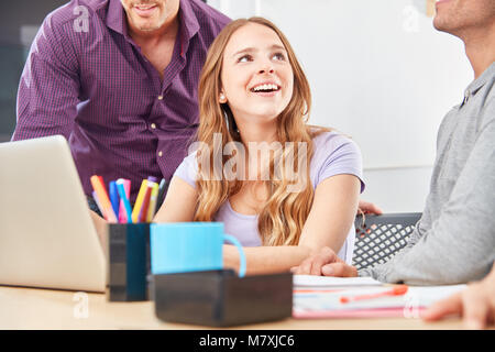 Young woman as apprentice or trainee in a workshop in the business start-up Stock Photo