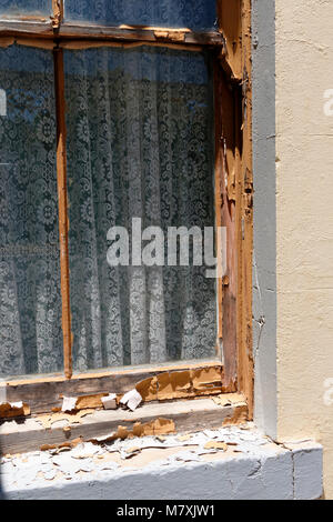 An old glass window with peeling paint into a log shed Stock Photo - Alamy
