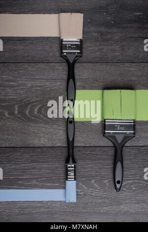 Paint brushes on wooden plank Stock Photo - Alamy