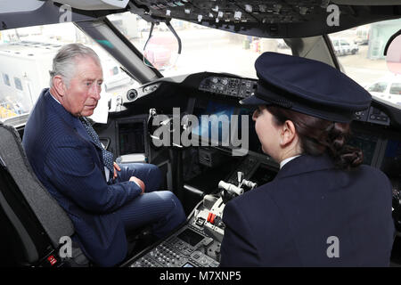 The Prince of Wales is shown the cockpit of a British Airways 787 aircraft by BA Senior First Officer Kate Beesley during a visit to Heathrow Airport, London, as he highlights the work done by security and airport personnel to keep the country and the airport safe. Stock Photo