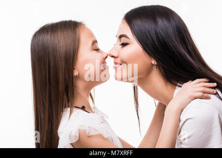 Portrait of happy mother and daughter isolated on white. Daughter kissing mother. Happy family. Happy mother's day. Mothers day card. Stock Photo