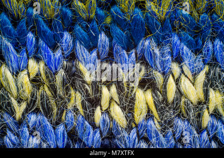 Colorful Knit Fabric Texture. Macro View of a Knitted Sweater. Blank Backdrop Stock Photo