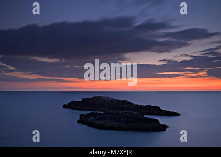 Rocks with seabirds in the sea off Llanddwyn Island, Anglesey, North Wales Stock Photo