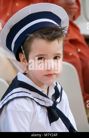 Little sailor,Boy with snot in his nose dressed in navy costume Stock Photo