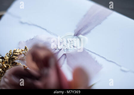 Graphic arts of beautiful wedding calligraphy cards with flower and chiffon bobbins on wood background. Beautiful wedding invitation. Details from fab Stock Photo