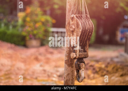 Asian worker installing wet-process bored pile for outside public construction Stock Photo