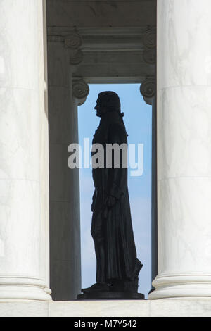 Monumental bronze state of Thomas Jefferson, seen in silhouette at the Jefferson Memorial in Washington, DC. Stock Photo