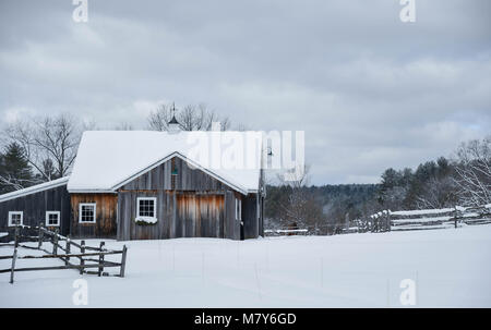 A weathered barn in the snow on an Amherst, New Hampshire, farm Stock Photo
