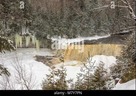 A winter wonderland, surrounds Tahquamenon Falls, a popular waterfall in the Upper Peninsula of Michigan. Stock Photo