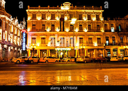 Havana, Cuba - December 13, 2016:  Night view of the Gran Teatro de La Habana (Great Theatre of Havana) and the famous hotel Inglaterra near the Centr Stock Photo