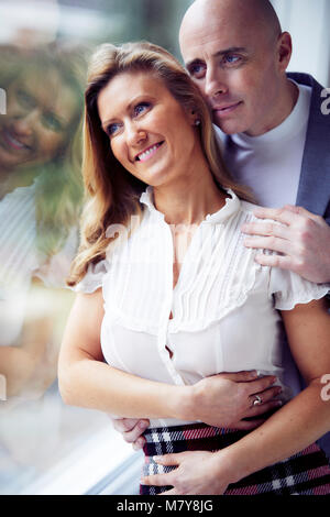 Happy couple stood together Stock Photo