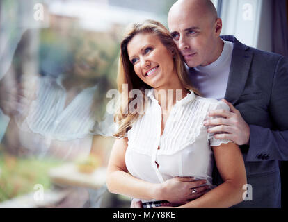 Happy couple stood together Stock Photo