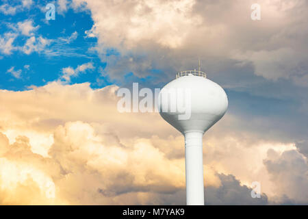 Water tower against a cloudy sky. Stock Photo