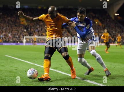 Wolverhampton Wanderers' Benik Afobe and Reading's Thiago Ilori battle for the ball during the Sky Bet Championship match at Molineux, Wolverhampton. Stock Photo