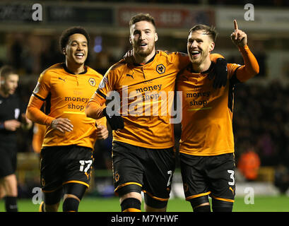 Wolverhampton Wanderers' Matt Doherty (centre) celebrates scoring his side's third goal of the game with Helder Costa (left) and Barry Douglas during the Sky Bet Championship match at Molineux, Wolverhampton. Stock Photo