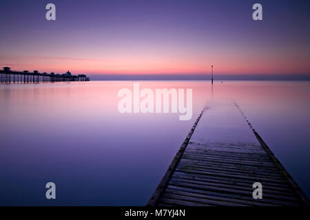Llandudno pier and jetty at dawn on the North Wales coast Stock Photo