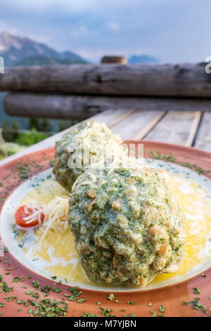 austrian spinach dumplings on a table Stock Photo