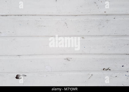 Abstract grunge background white color, metal sheet with horizontal relief stripes and stains of dirt. Stock Photo