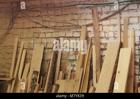 Wood Factory Stock and Lumber Board with Nature Business Export against Brick Background. Stock Photo