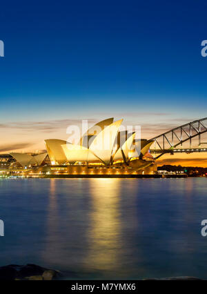 Sydney Opera House with Sydney Harbor Bridge, Sydney Harbour Bridge at sunset Sydney Australia New South Wales. Stock Photo