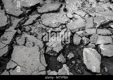 Cracked asphalt texture background Stock Photo