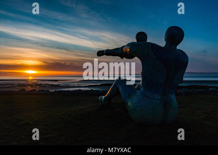 Scalestone Piont, Morecambe, Lancashire, United Kingdom, 13th March 2018        Shane A Johnstones Venus and Cupid in the setting sun across Morecambe Bay Erected in 2005 in memory of the 24 Cockle pickers who lost their lives in the after being trapped by the incoming tide the previoud year. Formed in 2011 the Venus and Cupid Trust has been responsidle for the care of the statue  after the artist threatened to destroy the sculpture as the local council was not prepared to pay for its upkeep or insurance Credit: Photographing North/Alamy Live News Stock Photo