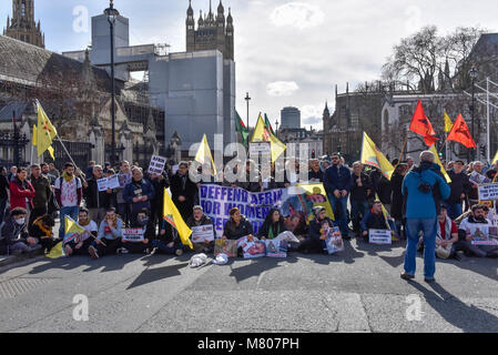 London, UK. 14 March 2018.  Kurdish supporters stage a demonstration in the road outside the Houses of Parliament protesting about Turkish oppression of Kurds in the city of Afrin. Credit: Stephen Chung / Alamy Live News Stock Photo