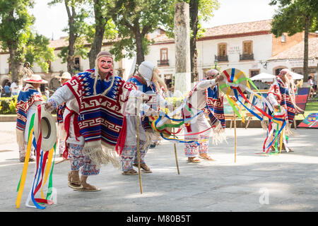 Costumed as old men traditional dancers perform the La Danza de los Viejitos or Old Man Dance in Plaza Vasco De Quiroga in Patzcuaro, Michoacan, Mexico. Stock Photo