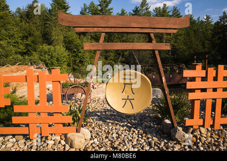 Japanese gong in a landscaped front yard Zen garden in summer, Quebec