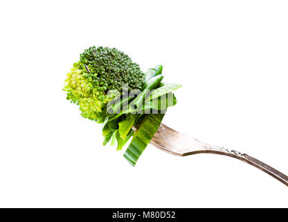 sliced  green vegetables on vintage fork Stock Photo