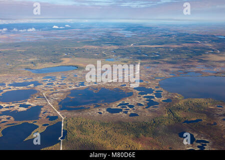 Top view of gas pipeline in endless swamps in tundra Stock Photo