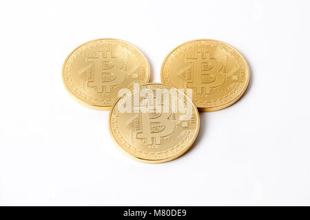 Golden Bitcoins on a white background Stock Photo