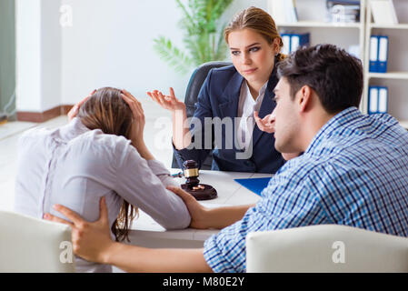 Young family filing divorce papers with lawyer Stock Photo