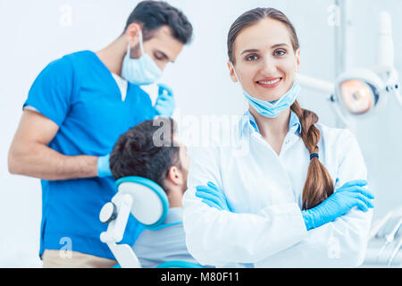 Portrait of a confident female dentist looking at camera in the dental office Stock Photo