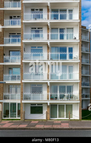 Block of flats on the seafront in Bexhill-on-Sea, East Sussex, UK. One of six blocks named after West Indian islands, this one called St Lucia Stock Photo