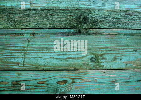 Old rustic wooden planks painted in turquoise color. Backgrounds concept Stock Photo