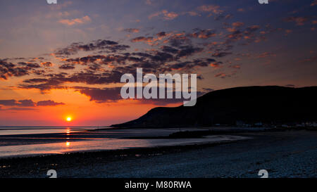 Sunset at low tide over the North Wales coast at Llandudno West Shore Stock Photo