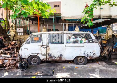 BANGKOK, THAILAND - APRIL 24: Rusty van on the street of Bangkok on April 24, 2016 in Bangkok, Thailand. Stock Photo