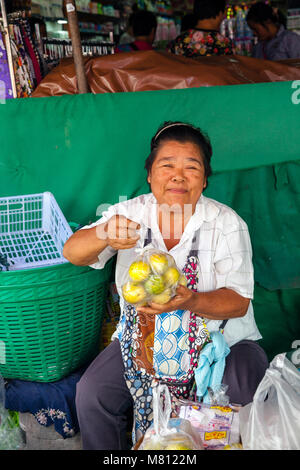 CHIANG MAI, THAILAND - AUGUST 24: Woman sells fruits at the market on August 24, 2016 in Chiang Mai, Thailand. Stock Photo